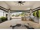 Entertain in this grand outdoor kitchen featuring stainless steel appliances and views of a landscaped backyard at 129 Hunts Landing Dr, Mooresville, NC 28117