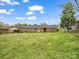 Spacious, level backyard with lush grass and privacy fence, perfect for outdoor activities at 1309 Briarcliff Rd, Shelby, NC 28152