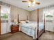 Charming bedroom features a four-poster bed, soft lighting, and traditional decor elements at 1309 Briarcliff Rd, Shelby, NC 28152