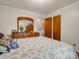 Bedroom featuring a dresser with mirror and coordinating linens, offering a harmonious and restful space at 1309 Briarcliff Rd, Shelby, NC 28152