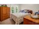 Bedroom featuring a dresser, wooden accents, and large windows, providing ample storage and natural light at 1309 Briarcliff Rd, Shelby, NC 28152