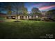 Charming brick ranch home with a well-manicured lawn and mature trees, perfect for curb appeal at 1309 Briarcliff Rd, Shelby, NC 28152