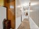 Long hallway with neutral tones, wood accents, and leads to various rooms of the house at 1309 Briarcliff Rd, Shelby, NC 28152
