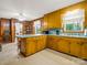 Spacious kitchen with ample counter space, classic cabinetry, and easy access to dining area at 1309 Briarcliff Rd, Shelby, NC 28152