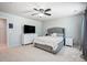 Bedroom with ceiling fan, large windows and carpeted floors at 13715 Sunrise View Dr, Charlotte, NC 28278