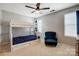 Bedroom with a bunk bed, ceiling fan, chair and carpeted floors at 13715 Sunrise View Dr, Charlotte, NC 28278