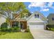 Charming two-story home featuring a brick and siding exterior, a two-car garage, and a well-manicured lawn at 13715 Sunrise View Dr, Charlotte, NC 28278