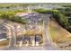 Stunning aerial view of a residential community surrounded by lush greenery and a serene lake, showcasing community layout at 16004 Tulloch Rd, Charlotte, NC 28278