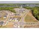 Community aerial view showcasing well-planned streets, residential areas, and proximity to a beautiful lake at 16004 Tulloch Rd, Charlotte, NC 28278