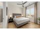Inviting bedroom with a large window, neutral decor, and a comfortable queen-size bed at 16004 Tulloch Rd, Charlotte, NC 28278