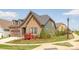Attractive home exterior with brick and siding, complemented by manicured landscaping, creating a welcoming curb appeal at 16004 Tulloch Rd, Charlotte, NC 28278
