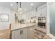 Modern kitchen with stainless steel appliances, a kitchen island, and white cabinetry at 16004 Tulloch Rd, Charlotte, NC 28278