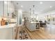 Open-concept kitchen with stainless steel appliances, a center island, and stylish pendant lighting at 16004 Tulloch Rd, Charlotte, NC 28278