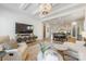 Sun-filled living room and kitchen with hardwood floors and stylish decor create a welcoming space to call home at 16004 Tulloch Rd, Charlotte, NC 28278