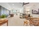 Bright and airy living room with a black accent wall, carpeted floors, comfortable seating and an open floor plan at 16004 Tulloch Rd, Charlotte, NC 28278