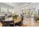 Bright living and dining areas feature hardwood floors, coffered ceilings, plantation shutters, and large windows at 16004 Tulloch Rd, Charlotte, NC 28278