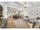 An open floor plan featuring a modern living room, dining area, and kitchen provides for great entertaining at 16004 Tulloch Rd, Charlotte, NC 28278