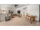 Open-concept living area features neutral colors, recessed lighting, and a doorway leading into the main bedroom at 16004 Tulloch Rd, Charlotte, NC 28278