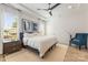 Comfortable bedroom with tray ceiling, plush rug, and large window for natural light at 16004 Tulloch Rd, Charlotte, NC 28278