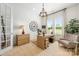 Bright home office featuring a modern desk, comfortable seating, and a large window at 16004 Tulloch Rd, Charlotte, NC 28278