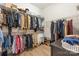 Spacious walk-in closet with custom shelving and ample storage space for all your wardrobe needs at 16004 Tulloch Rd, Charlotte, NC 28278
