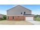 Exterior view of home with brick and gray siding, and a two-car garage at 1701 30Th Avenue Ne Ct, Hickory, NC 28601