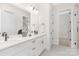 Elegant white bathroom with double sinks, modern fixtures, and ample counter space at 1701 30Th Avenue Ne Ct, Hickory, NC 28601