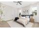 Bright bedroom with two windows offering natural light and a ceiling fan at 1701 30Th Avenue Ne Ct, Hickory, NC 28601