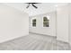 Empty room with carpet, two windows, ceiling fan and recess lighting at 1701 30Th Avenue Ne Ct, Hickory, NC 28601