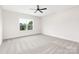 An airy bedroom featuring plush carpeting and a ceiling fan at 1701 30Th Avenue Ne Ct, Hickory, NC 28601