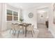 Well-lit dining area with neutral tones, adjacent to the entryway at 1701 30Th Avenue Ne Ct, Hickory, NC 28601