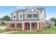 Charming two-story home with brick and gray siding, complemented by a well-manicured lawn at 1701 30Th Avenue Ne Ct, Hickory, NC 28601