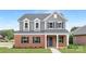 Charming two-story home with brick and gray siding, complemented by a well-manicured lawn at 1701 30Th Avenue Ne Ct, Hickory, NC 28601