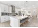 Modern kitchen featuring white cabinets, a large island with seating, and stainless steel appliances at 1701 30Th Avenue Ne Ct, Hickory, NC 28601