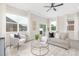 Bright living room with plush seating, a glass coffee table, and large windows for natural light at 1701 30Th Avenue Ne Ct, Hickory, NC 28601
