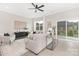 Bright living room with neutral tones, modern furniture, and natural light from sliding glass doors at 1701 30Th Avenue Ne Ct, Hickory, NC 28601