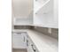 Pantry with white cabinets, gray backsplash, and quartz counters at 1701 30Th Avenue Ne Ct, Hickory, NC 28601