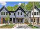 Newly built modern home featuring a stylish facade, well-manicured lawn, and a concrete driveway at 2008 St John St, Charlotte, NC 28216