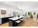 Modern kitchen featuring an island with seating, stainless steel appliances, and an open concept design at 2008 St John St, Charlotte, NC 28216