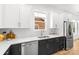 Beautiful kitchen featuring stainless steel appliances, white subway tile backsplash, and natural lighting at 2008 St John St, Charlotte, NC 28216