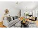 Bright living room with modern decor open to the dining area and staircase at 2008 St John St, Charlotte, NC 28216