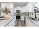 Granite counters complement the stainless steel appliances in this modern kitchen design at 203 Park Ave, Mount Holly, NC 28120