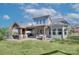 Beautiful backyard with a covered patio, lush lawn, and a well-maintained exterior at 2030 Bosna Ln, Fort Mill, SC 29715