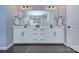 Elegant bathroom featuring double vanity, modern fixtures, large mirror, and neutral color palette at 2030 Bosna Ln, Fort Mill, SC 29715