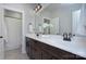 Bright bathroom featuring a double vanity, white countertop, and framed mirror at 2030 Bosna Ln, Fort Mill, SC 29715