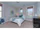 Comfortable bedroom featuring neutral tones, two windows, and plush carpeting at 2030 Bosna Ln, Fort Mill, SC 29715