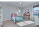 Cozy bedroom with a charming blue bed frame, soft carpet, and natural light at 2030 Bosna Ln, Fort Mill, SC 29715