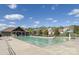 Large community pool with a clubhouse, nearby homes, and meticulously maintained grounds at 2030 Bosna Ln, Fort Mill, SC 29715