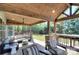 Inviting covered patio with comfortable seating, a ceiling fan, and a serene outdoor view at 2030 Bosna Ln, Fort Mill, SC 29715
