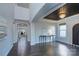 Elegant foyer showcases dark wood floors, a tray ceiling, and a grand arched entryway at 2030 Bosna Ln, Fort Mill, SC 29715